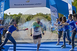 Runner sprayed with blue powder